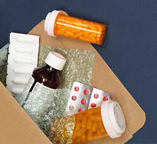Box of home-delivered prescriptions.